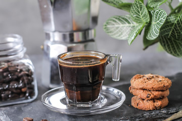 Photo of Coffee bean cookies with espresso coffee. Gray background. Various Cookies. Roasted bean. Vintage style.