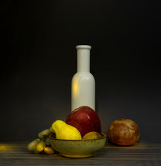 Vintage assortment of apple, pomegranate and grapes