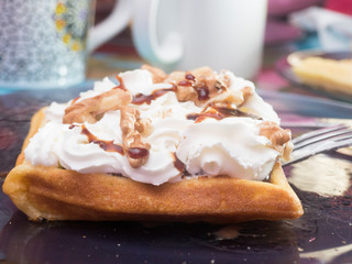 Waffle with cream and caramel ready to eat