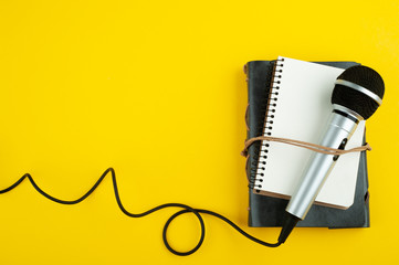 Microphone and empty open note book