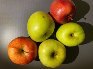 apples on gray table