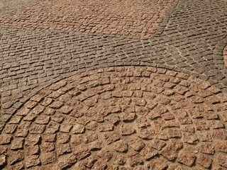 Old paving stones in perspective closeup, background, texture.