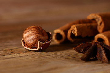 hazelnuts with split shells on a wooden table close-up
