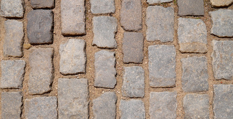 Old paving stones closeup, background, texture.