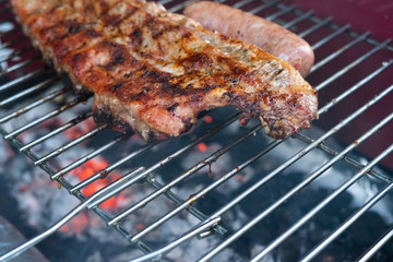 Pulling pork ribs grilled over the coals. Concept of food. Copy space.