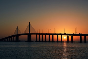 Fototapeta na wymiar Silhouette of bridge at sunset