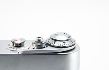 Old film retro camera. Shutter and trigger (button) close-up. Metallic black. White isolated background.