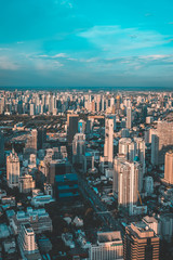 Vew of Bangkok skyline and skyscraper seen from Mahanakhon Tower Famous skyscrapers in day time