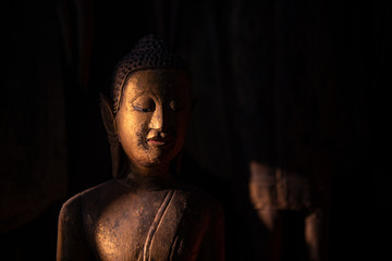 Buddha statues in Wat Xieng Thong in Luang Prabang , Laos - 323763539