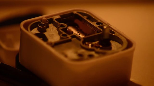 Macro of the inside of a vintage music box. the drum spins and the tiny teeth pluck the comb to play notes