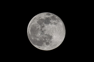 Obraz na płótnie Canvas Earth's moon glowing on black background