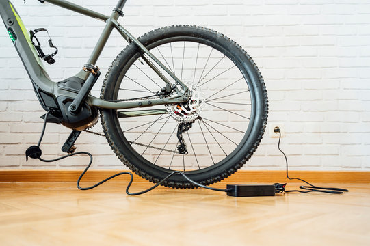 Electric bicycle with charging cable