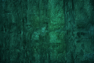 Deep green retro stone wall texture background low key