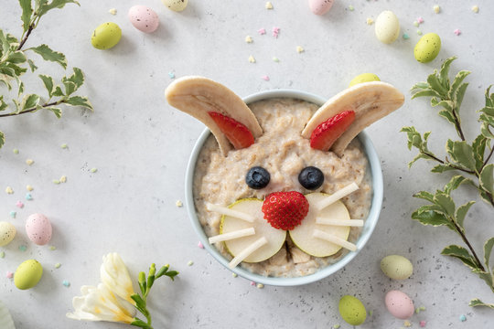 Funny bunny oatmeal bowl with fruits, for kids Easter breakfast