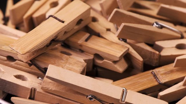 Pile of vintage wooden bamboo clothespins or cloth pegs