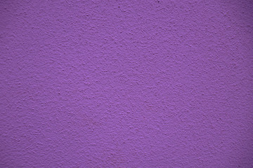 Violet wall surface for. Violet background for text and design.