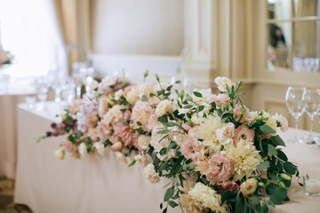 bouquet  with fresh flowers on the table in restaurant 