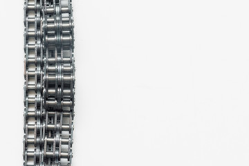 Valve train chain close up on the white background with copy space.