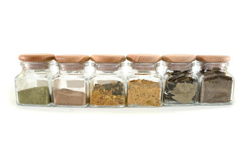 spices in jars isolated on a white background.