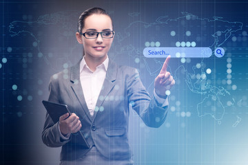 Search concept with businessman pressing button