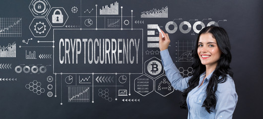 Cryptocurrency theme with young woman writing on a blackboard