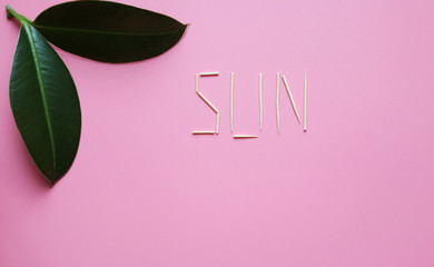 pink background and the inscription rest. copy space and flat lay