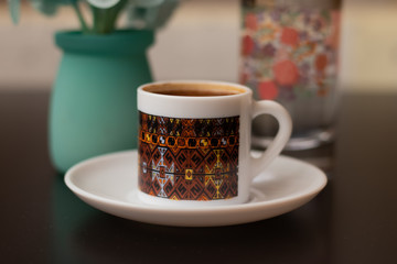 Foamy Turkish coffee in the little coffee cup