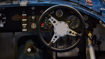 Details of interior classic car. Classic car steering wheel