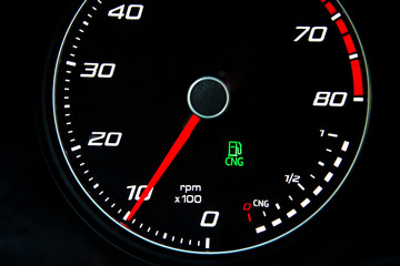 Eco car odometer with CNG tank.