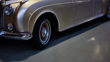 Obraz na płótnie Canvas Detail of classic car. Close-up of headlight