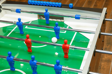 Foosball ball on table football table with figures