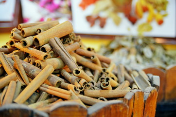 cinnamon sticks and spices on wooden table