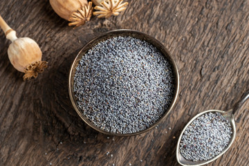 Poppy seeds and capsules on a table