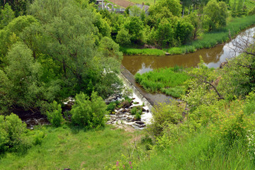 Fototapeta na wymiar artificial rapids on the river