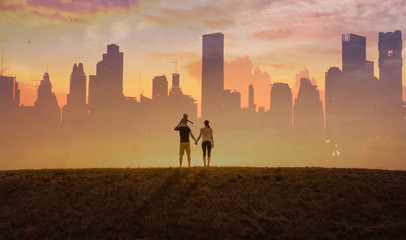 Happy family together in the city. Double exposure futuristic feel. 