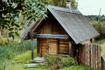 Fototapeta na wymiar Old traditional vintage timber sauna in the village