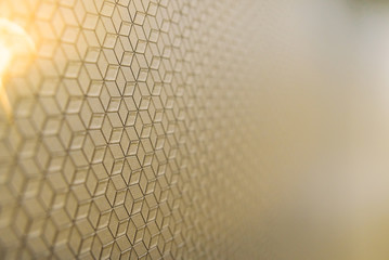 Background with simple mosaic engraving of straight lines, gradient blur and illuminated in a corner.