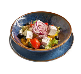Bulgarian Cuisine: Shopska vegetables salad with feta cheese close-up on a plate, on isolated on white background