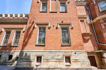 Naklejka premium The windows of the old palace with a metal mesh for security