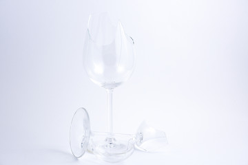 broken water glass on the on the white background The concept of accidents in the kitchen is dangerous for the body and young children inside the house.