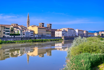 Fototapeta na wymiar A daytime view along the Arno River in Florence, Italy.