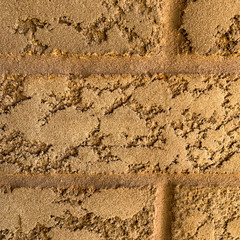 Rough brick wall background texture. Closeup of rectangular brick surface. Warm, natural or sand color. photo.