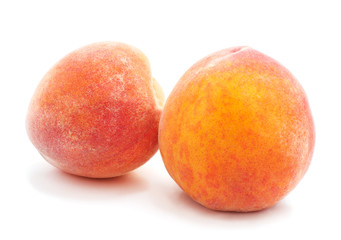 Two ripe peaches.