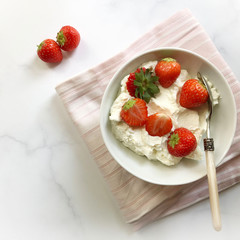 Fresh, fruity strawberries with sweetened sour cream. Spring and Summer Dessert.