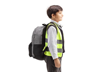 Schoolboy with a safety vest standing