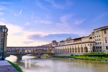 A view along the Arno River towards the Ponte Vecchio in Florence, Italy.