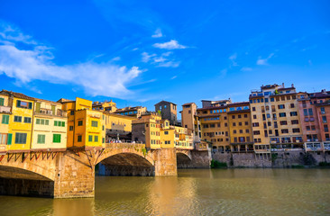 Fototapeta na wymiar A view along the Arno River towards the Ponte Vecchio in Florence, Italy.