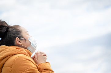 The image of a young Asian woman wearing a mask to prevent germs, toxic fumes, and dust. Prevention...