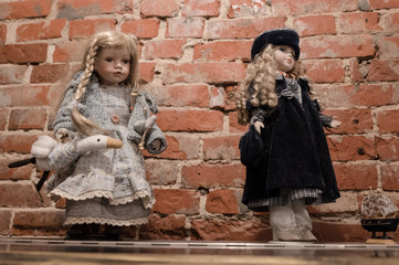 Two porcelain dolls in beautiful dresses