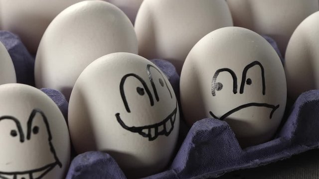 The smiley and frown face on the side shell of the egg